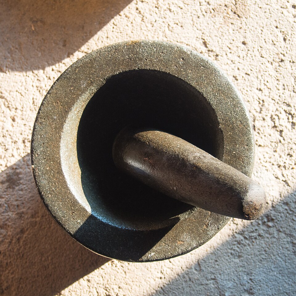 A stone mortar and pestle, shown as an illustrative object; not a treatment recommendation