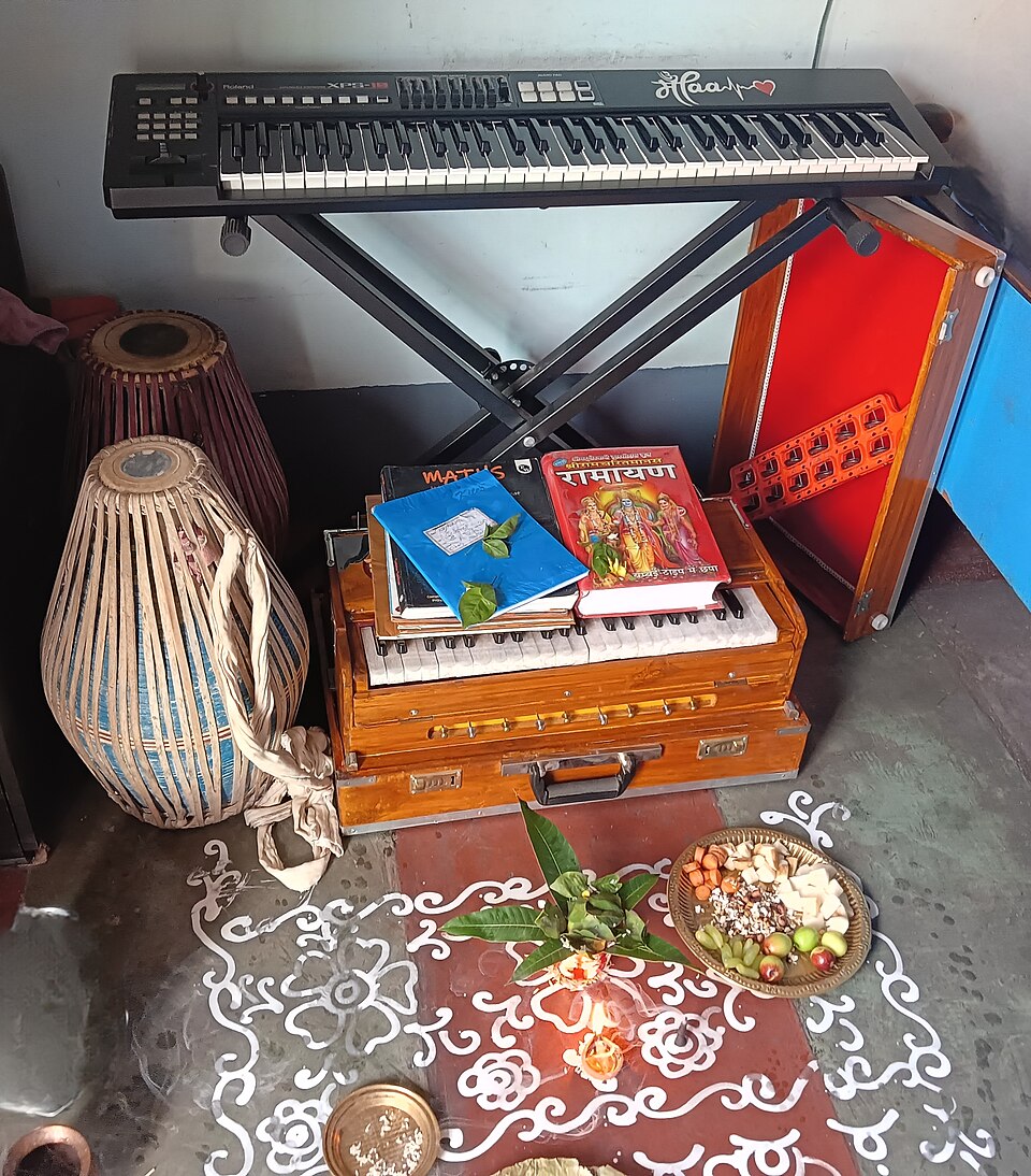 Books and musical instruments placed for Saraswati Puja ritual in India