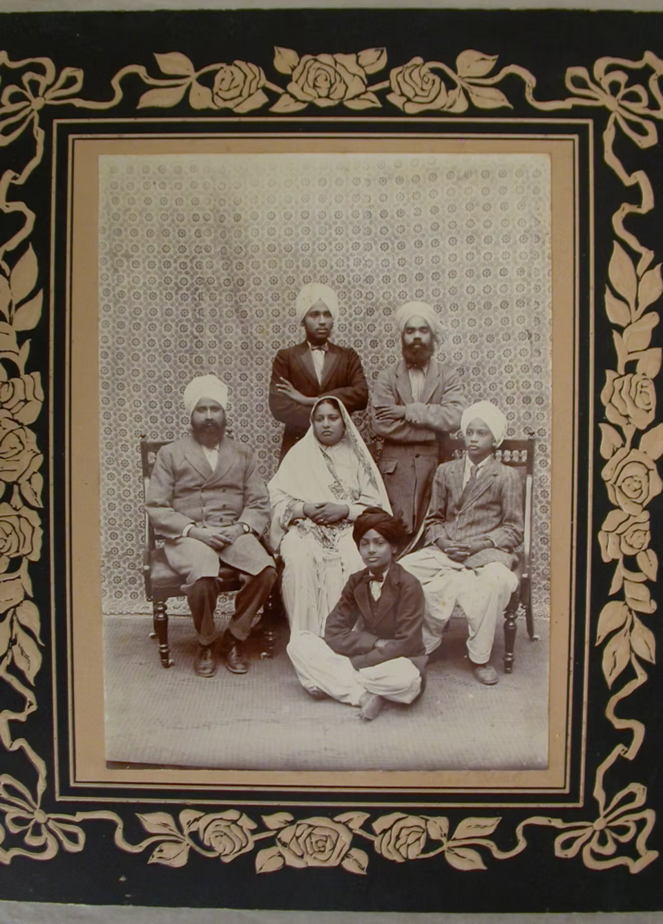 Historical Punjabi Sikh family portrait, dated by the source to about 1900–1940. An illustration of preserving family photographs, not a depiction of a shraddha rite.
