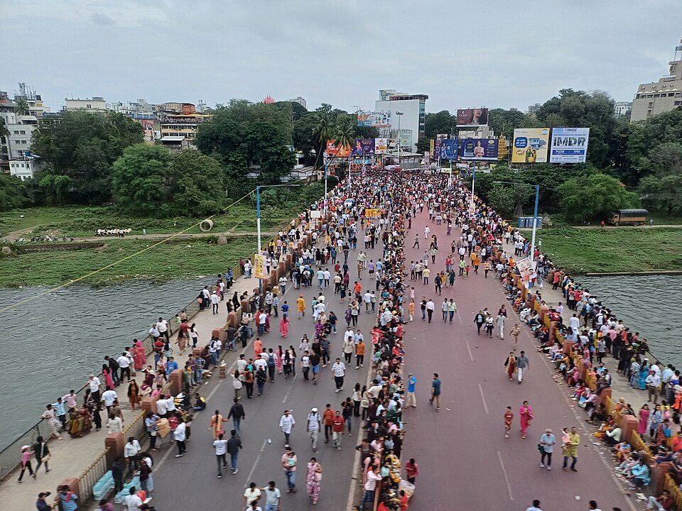 Crowd on the Lakdi Pul during the Ganesh Visarjan Procession 2025