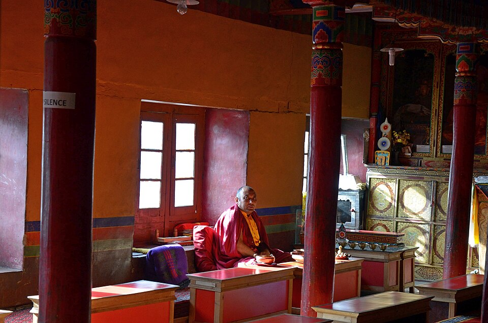 A monk reading and chanting from a text at a monastery near Leh, Ladakh