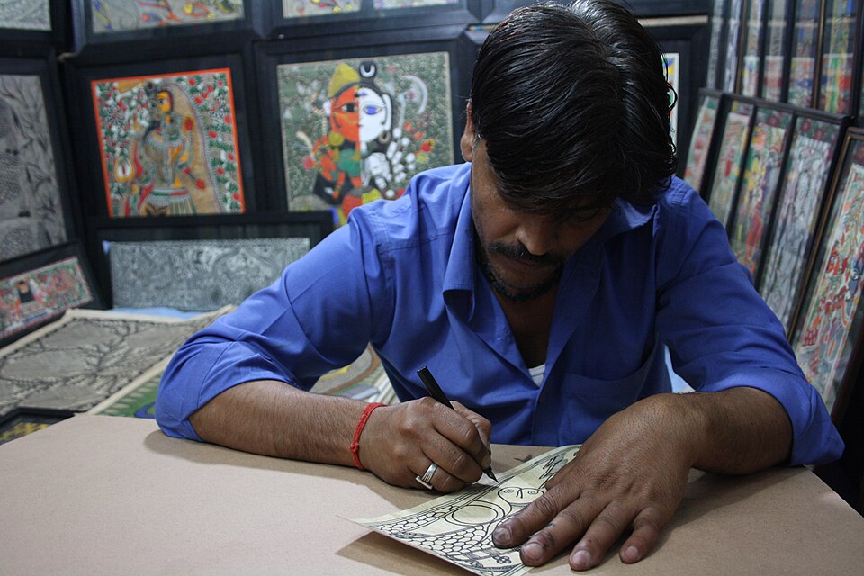 A Mithila painting artist at Dilli Haat