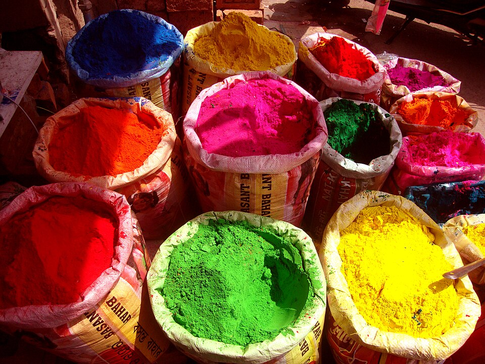 Coloured powders displayed in a shop for Holi