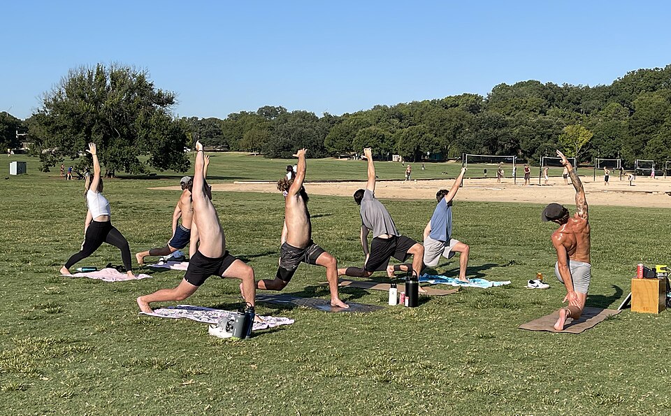 A group practising yoga at Zilker Park in Austin, Texas